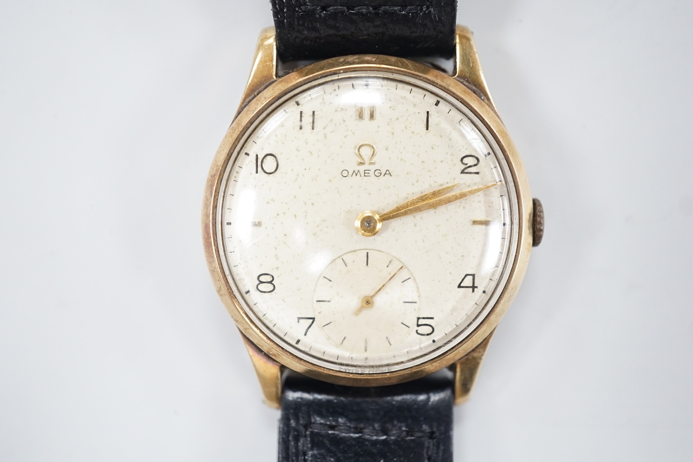 A gentleman's 1950's 9ct gold Omega manual wind wrist watch, movement c.265, case diameter 34mm, on later associated leather strap.